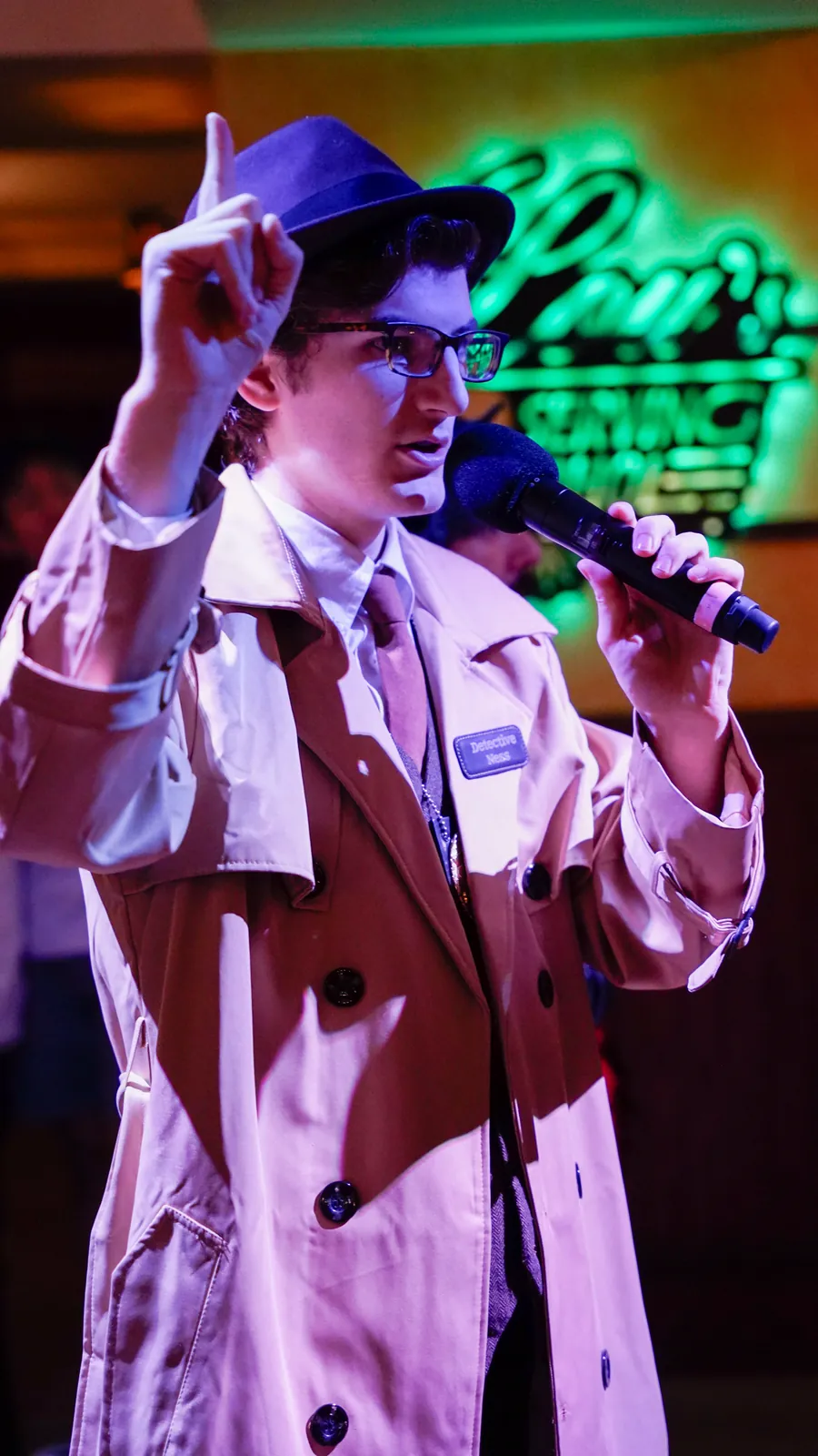 A Murder Mystery Company actor working the room at a Burlington show